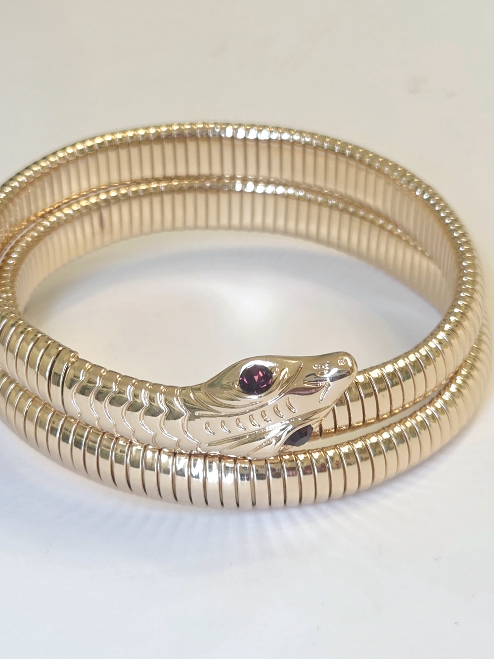 Vintage 1970s Gold-Tone Flexible Serpent Bracelet With Deep Amethyst Eyes